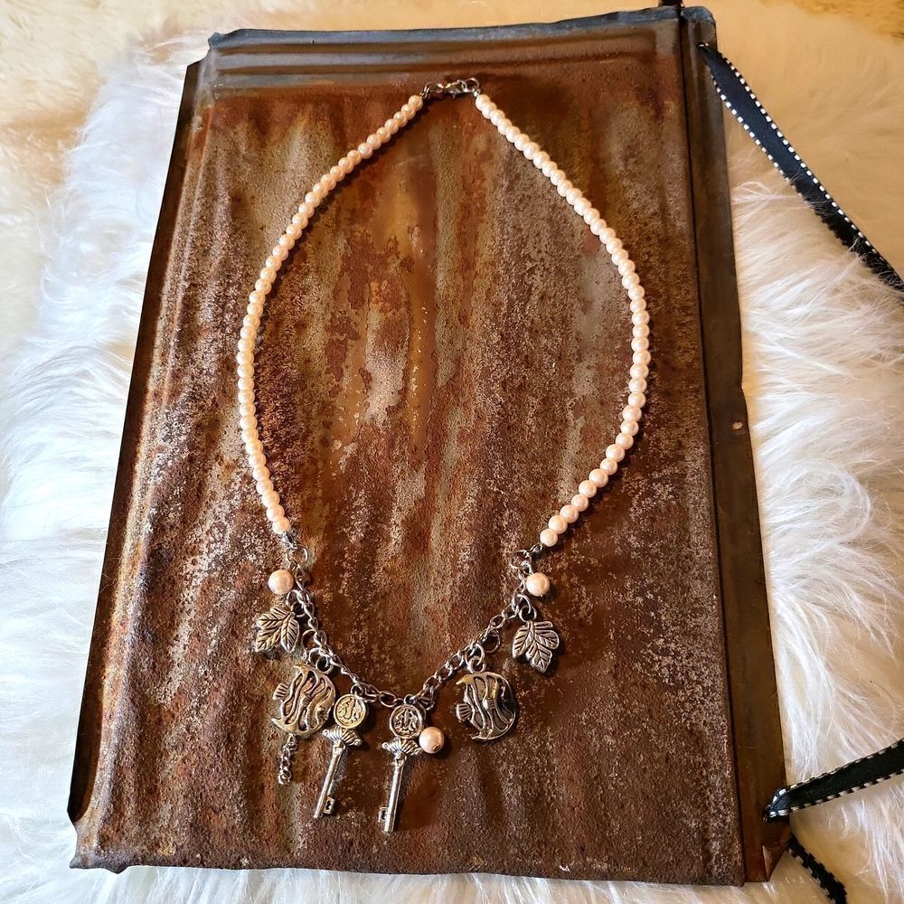 Faux pearl and faux key,leaf,and fish necklace